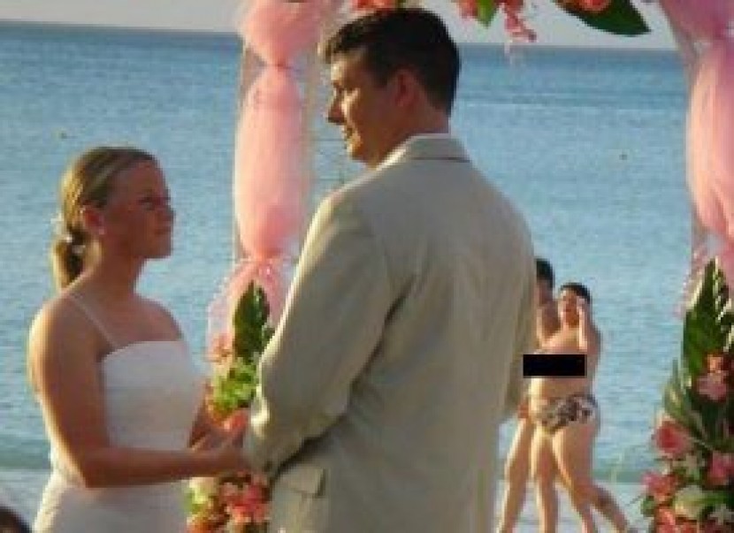 beeach wedding with topless photobamb